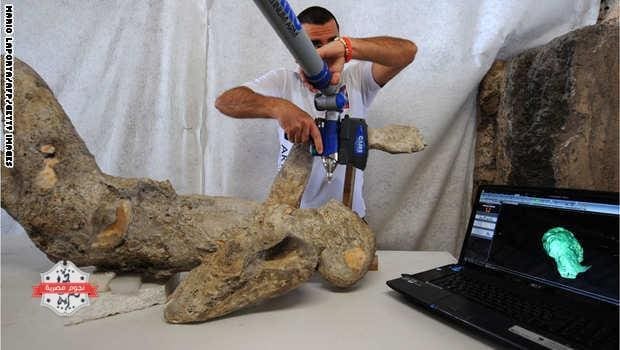 A restorer works with a laser scaner on a petrified victim of the eruption of Vesuvius volcano in 79 BC، as part of the restoration work and the study of 86 casts in the laboratory of Pompeii Archaeological Site، on May 20، 2015 in Pompeii. AFP PHOTO / MARIO LAPORTA (Photo credit should read MARIO LAPORTA/AFP/Getty Images)